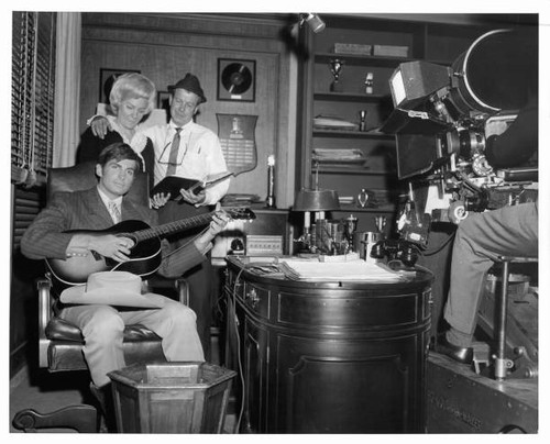 George hamilton strums the - george,
